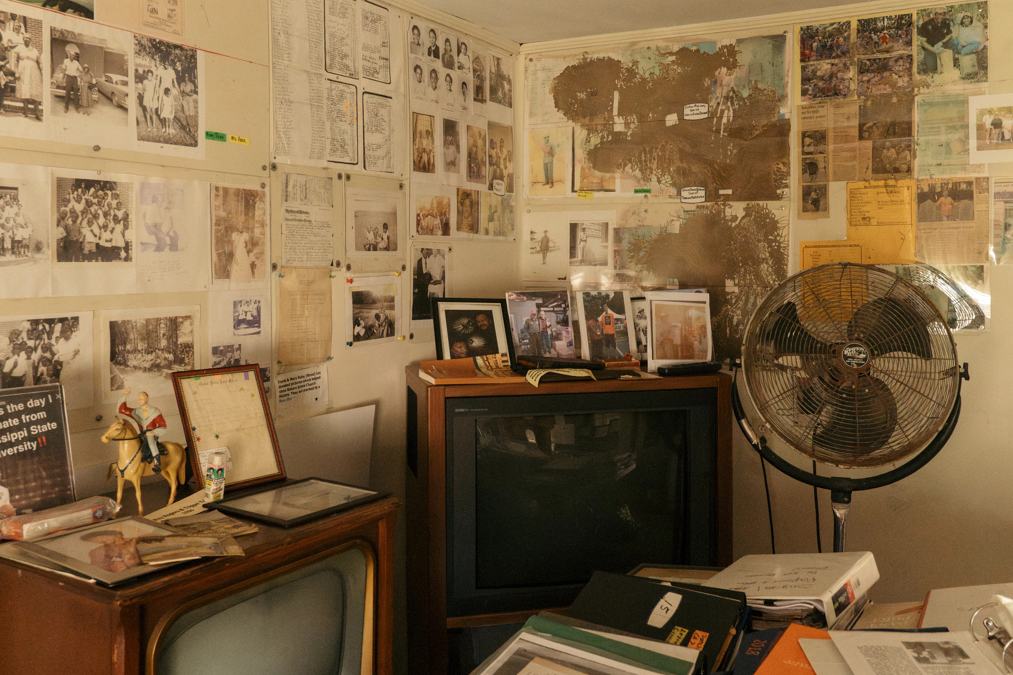 photos documents and other things hang on the walls