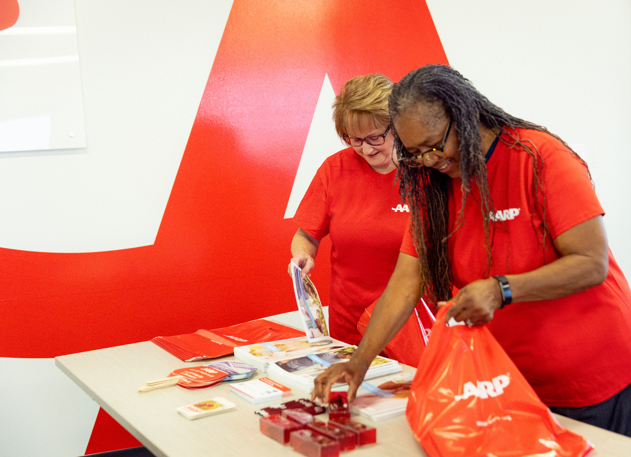 Image of Volunteer at the AARP Table during MLK Day