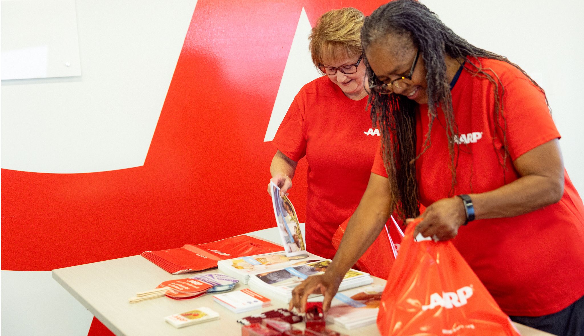 Image of Volunteer at the AARP Table during MLK Day Image of Volunteer at the AARP Table during MLK Day