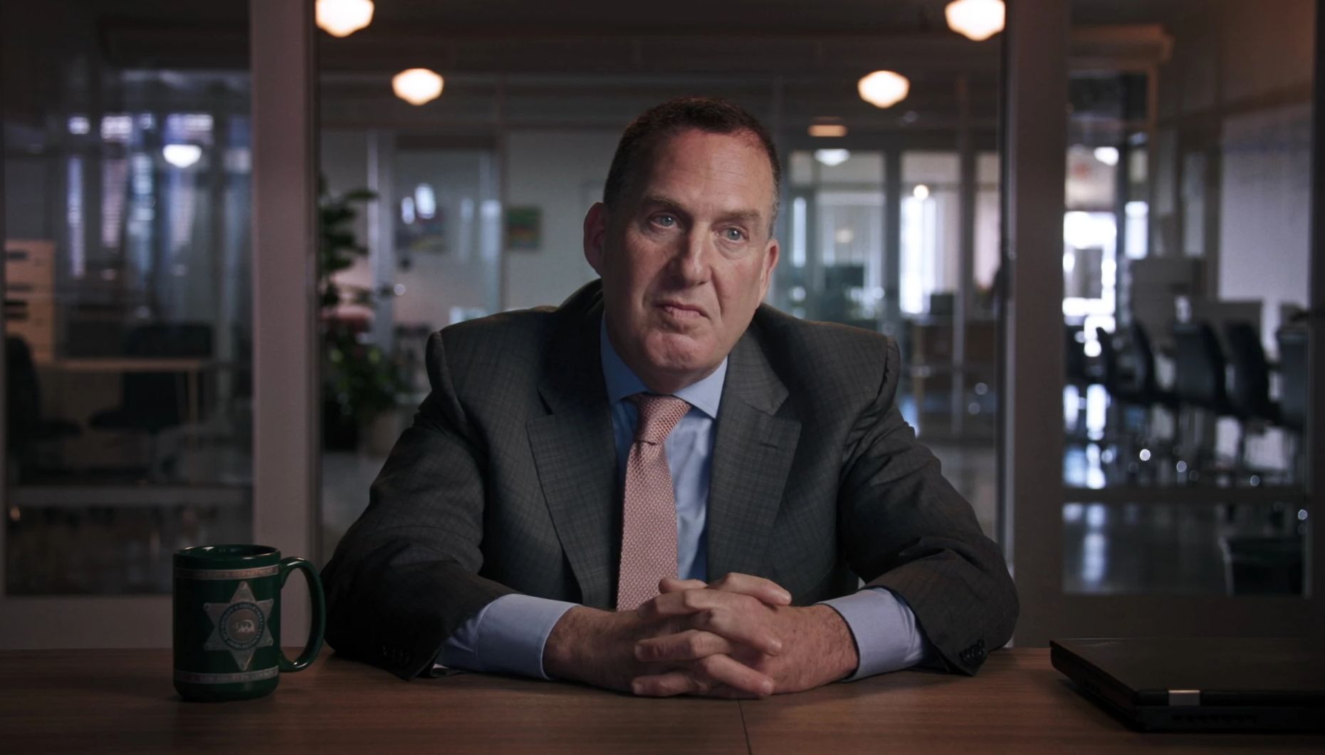 Los Angeles County Deputy District Attorney John Lewin Los Angeles County Deputy District Attorney John Lewin sitting at a table for interview
