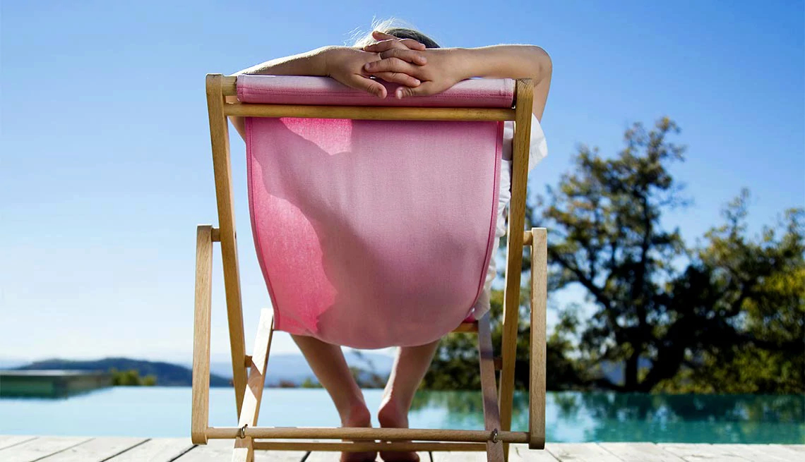 Person relaxing in chair outside, optimal retirement number