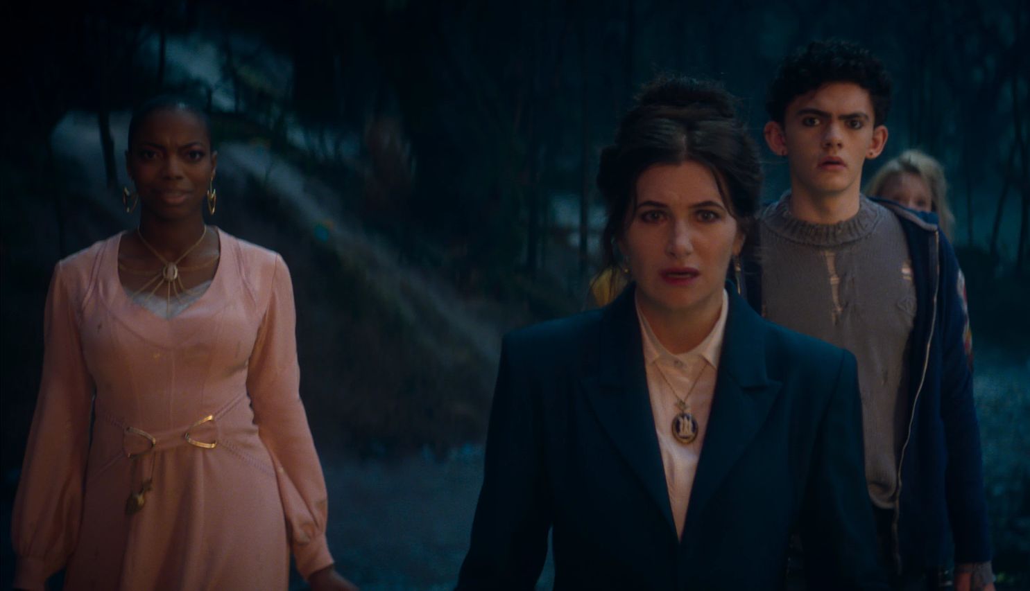 Kathryn Hahn stars in 'Agatha All Along' Sasheer Zamata, Kathryn Hahn, Joe Locke and Debra Jo Rupp outside in the dark in a still from Agatha All Along