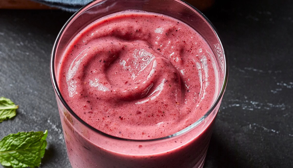 A close-up view of a berry-mint kefir smoothie
