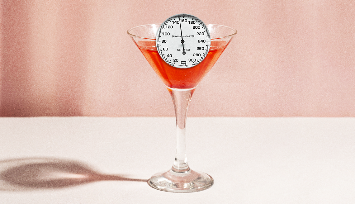 a blood pressure gauge sitting in a cocktail glass
