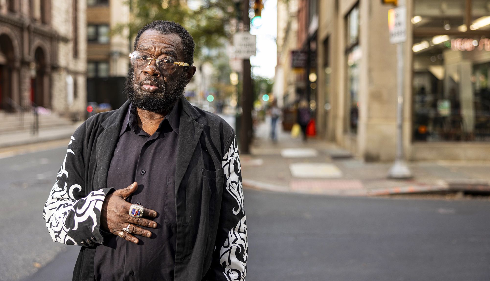 Keith Crippen  a man in a black shirt and glasses looks at the camera