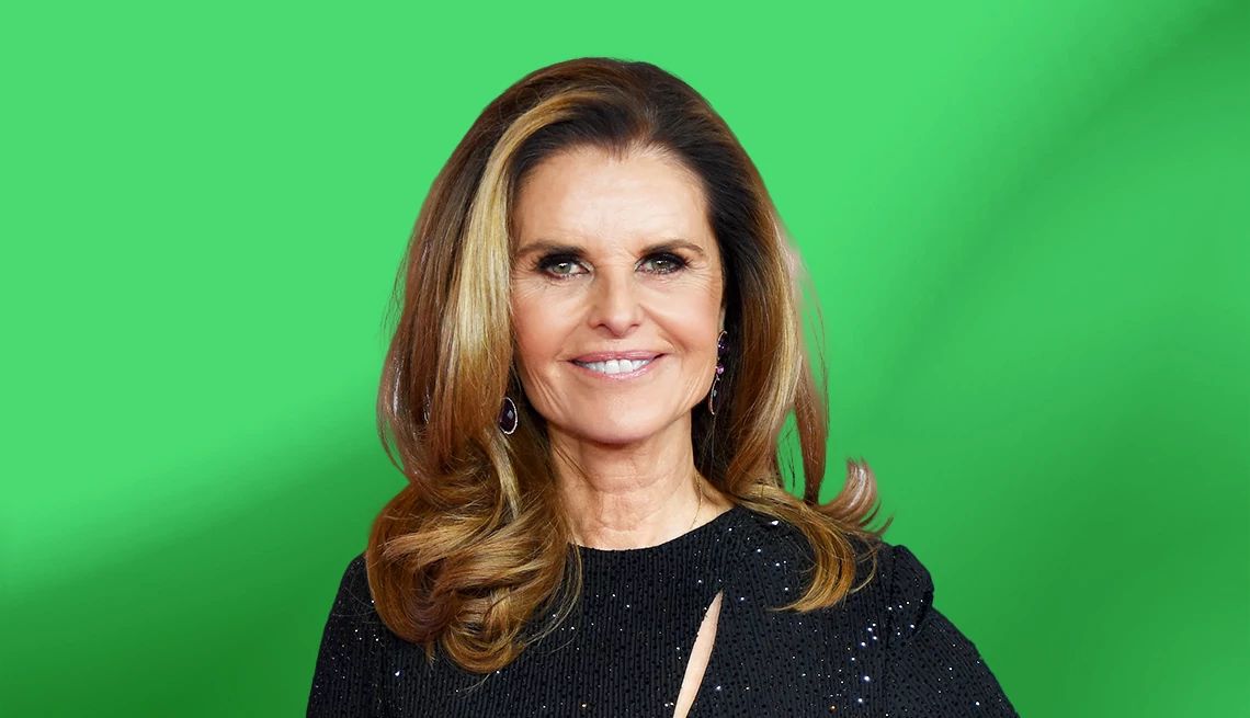 Maria Shriver against green ombre background