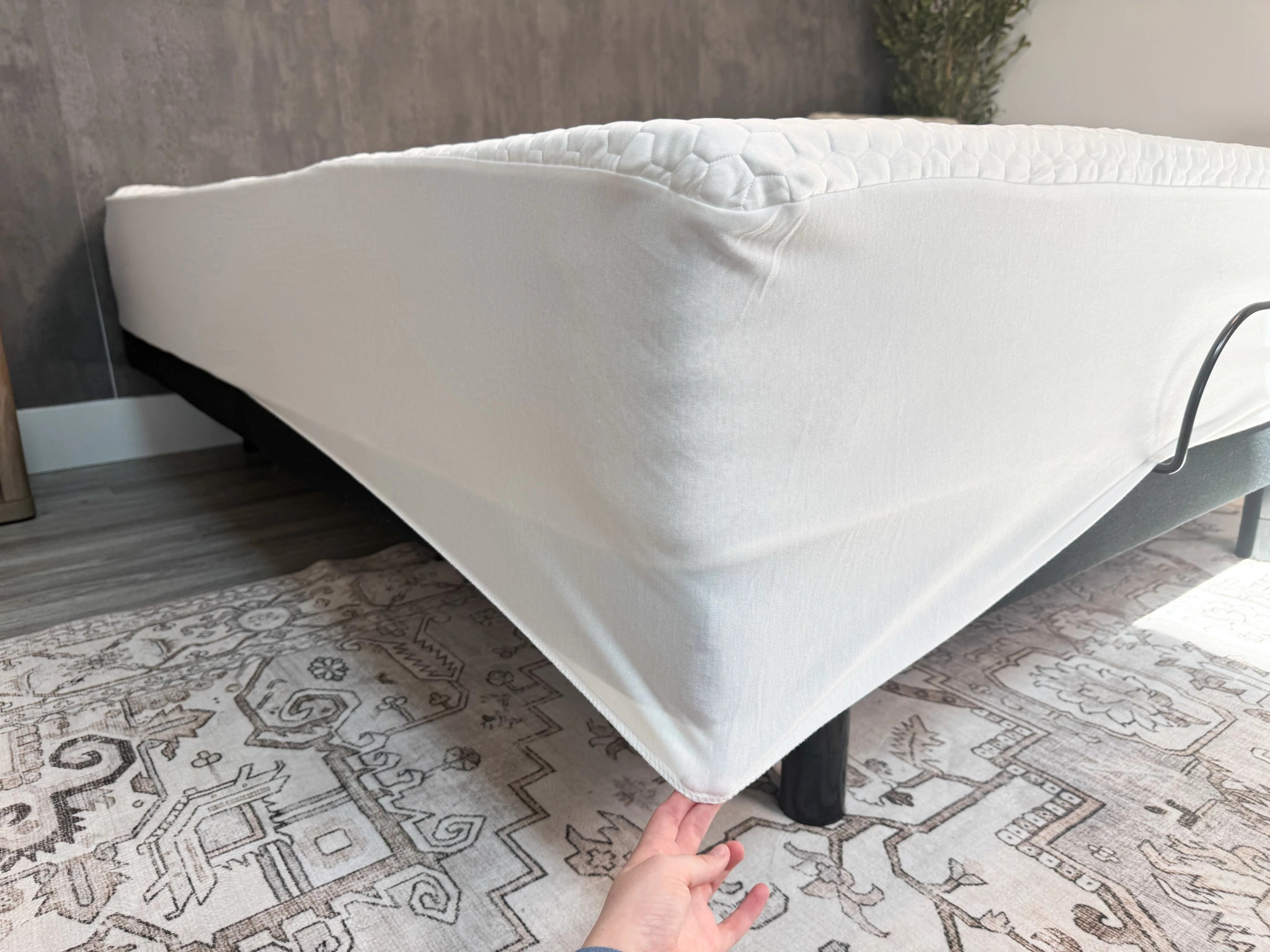 The Brooklyn Bedding Luxury Cooling Mattress Protector on a bed.