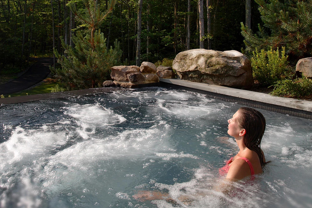 Person floating in water during a calming wellness moment associated with healthy aging