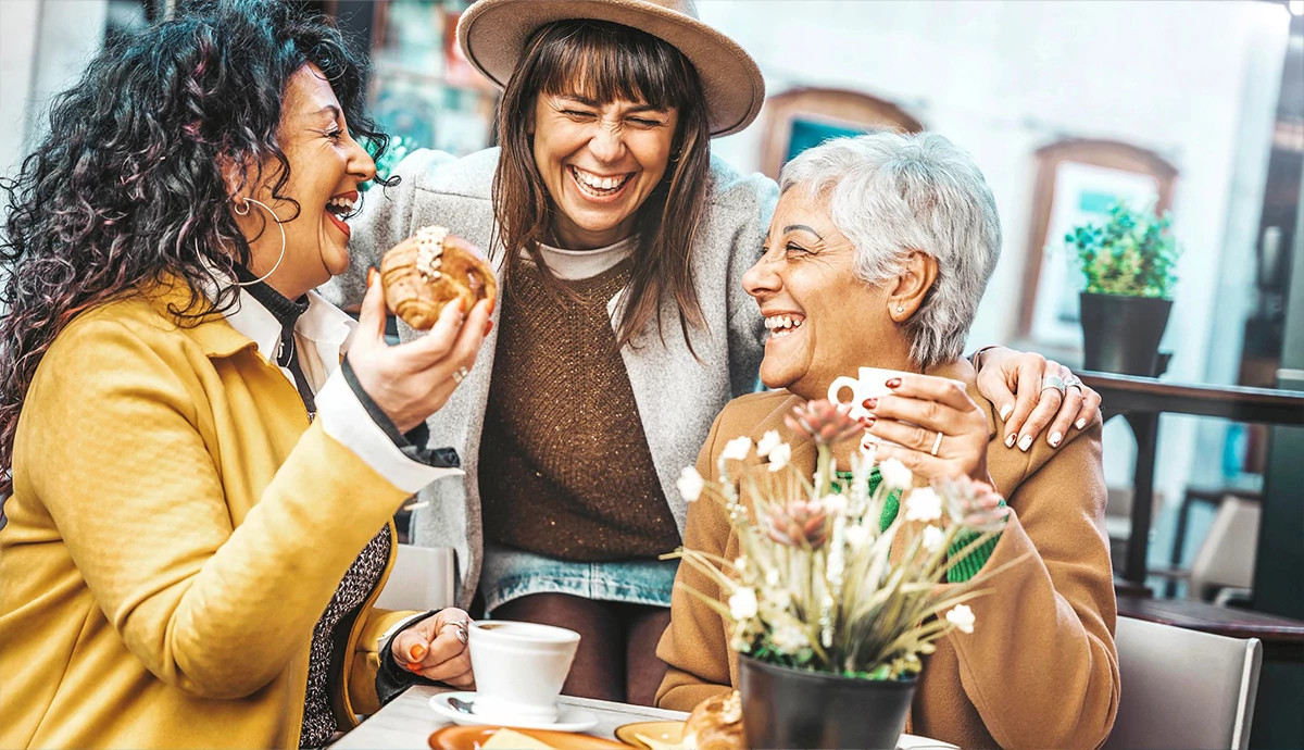 Group of women enjoying brunch together at a local restaurant using their AARP member discounts