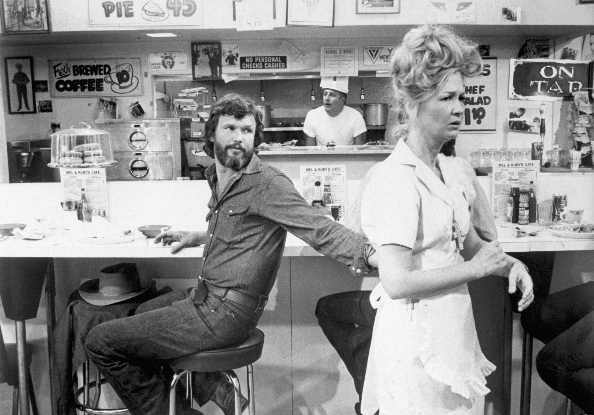 kris kristofferson and diane ladd in a diner setting for alice doesn't live here anymore