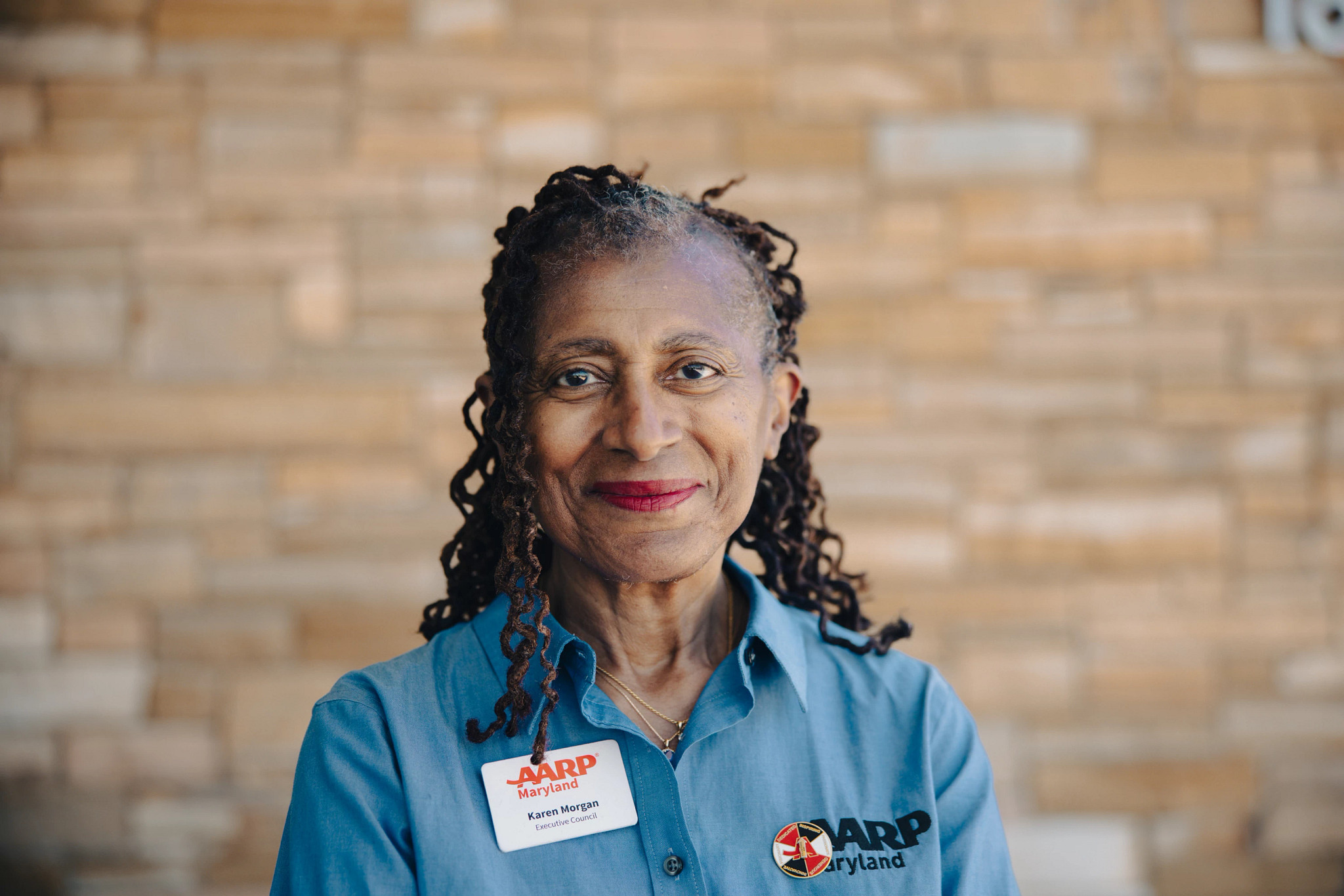 Volunteer Karen Morgan poses after a presentation in Maryland